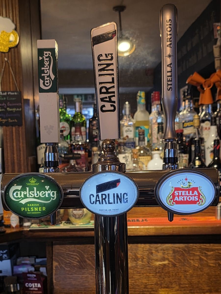 Carlsberg, Carling and Stella Artois taps on the bar at The Hop Bind