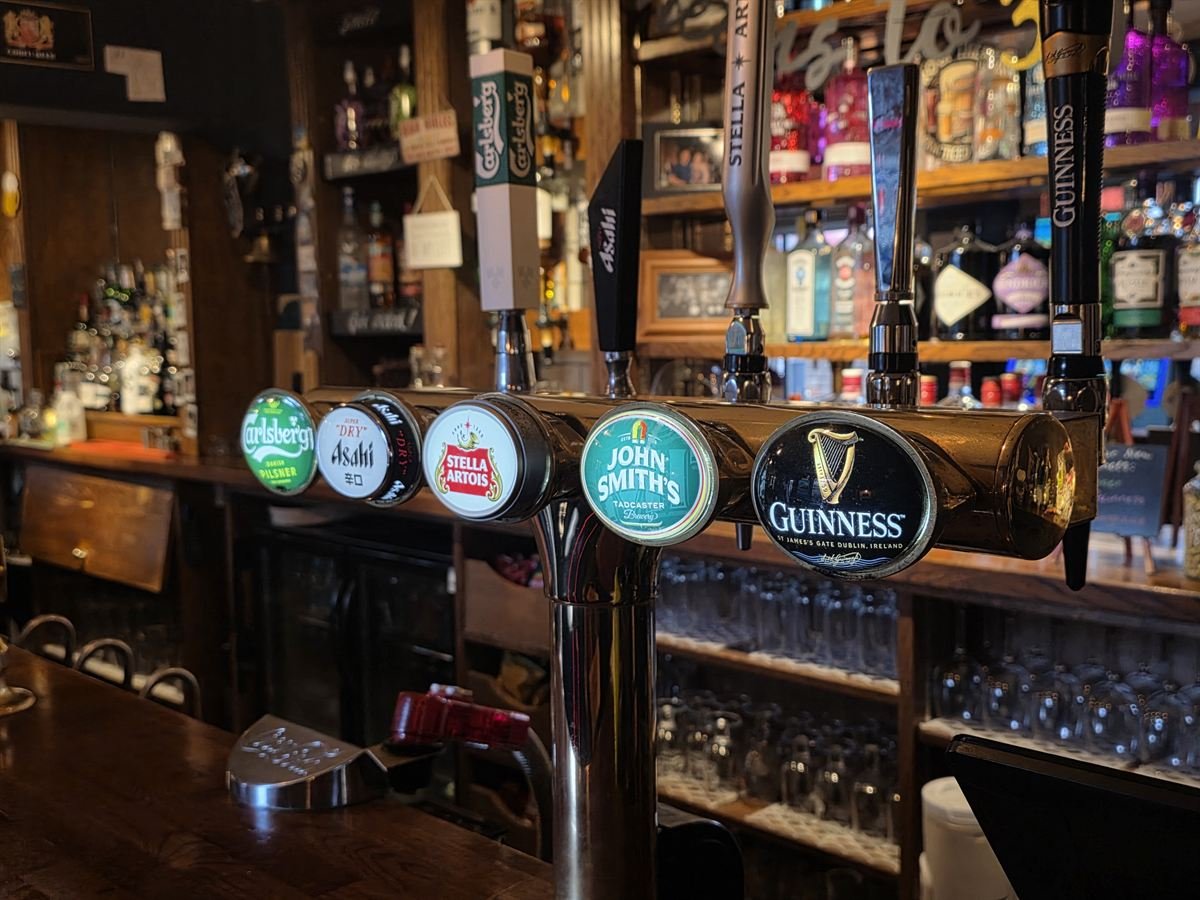 Carlsberg, Asahi, Stella Artois, John Smith's and Guinness taps on the bar at The Hop Bind